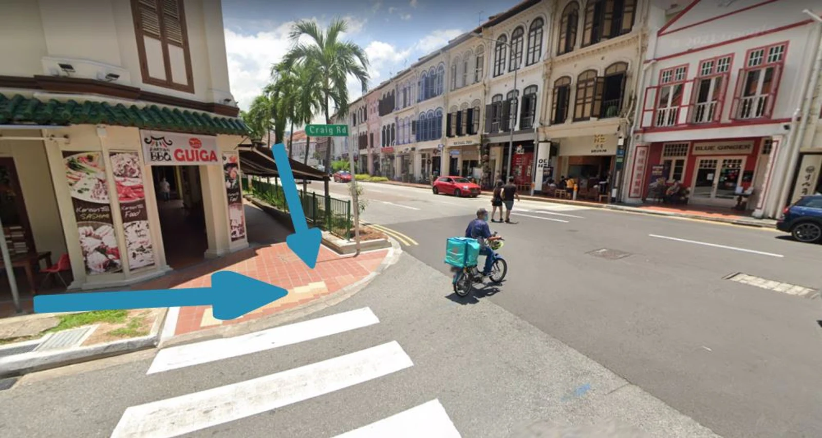 Figure 2: The blue arrows indicate the flow of water from the 2 drainages that intersects at the junction of Craig Road and Tanjong Pagar Road