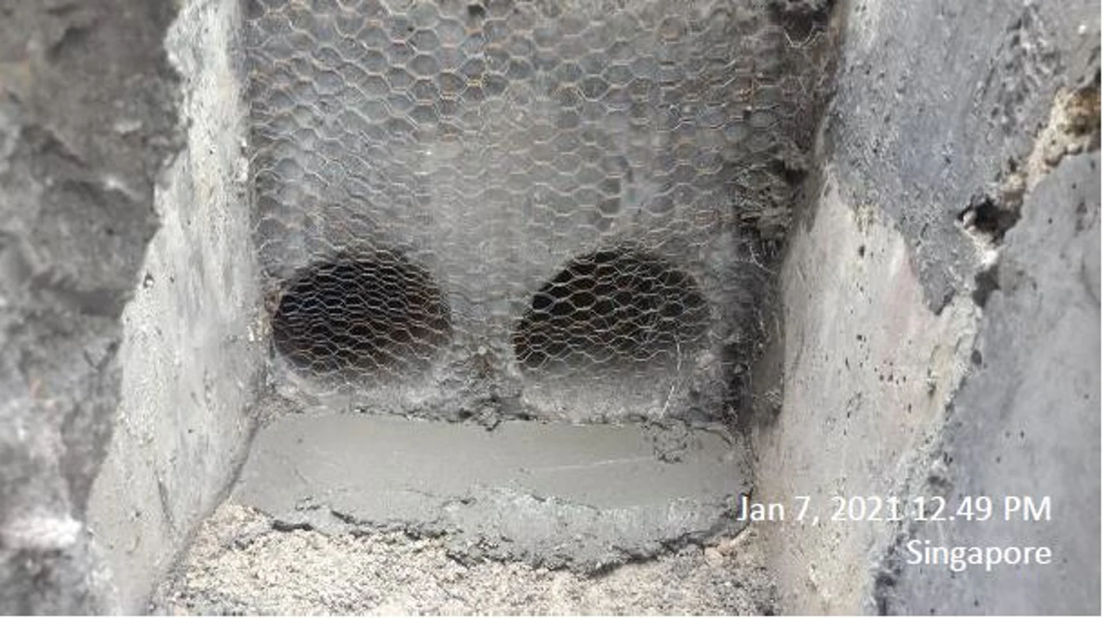 Figure 23: Casting of the concrete wall connecting the steel pipes to the drain