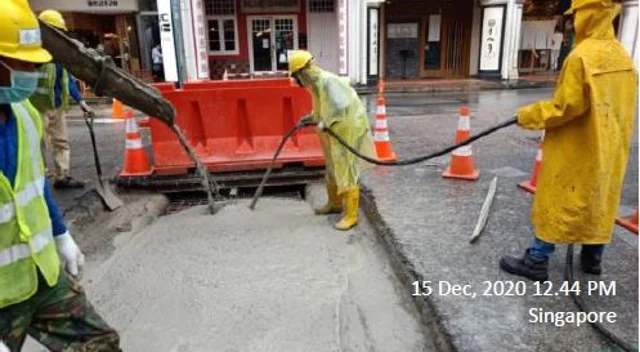 Figure 11: Pouring the cement onto the B10 mesh and pipes
